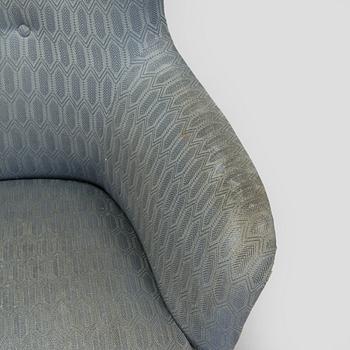 A pair of mid-20th century armchairs.