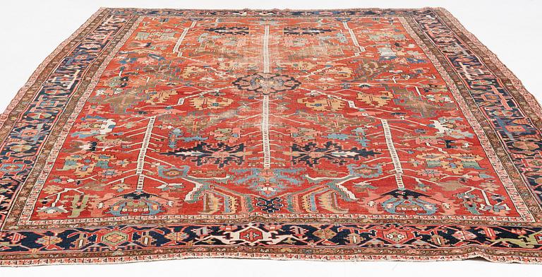 A antique Heriz carpet, ca 384 x 275 - 290 cm.