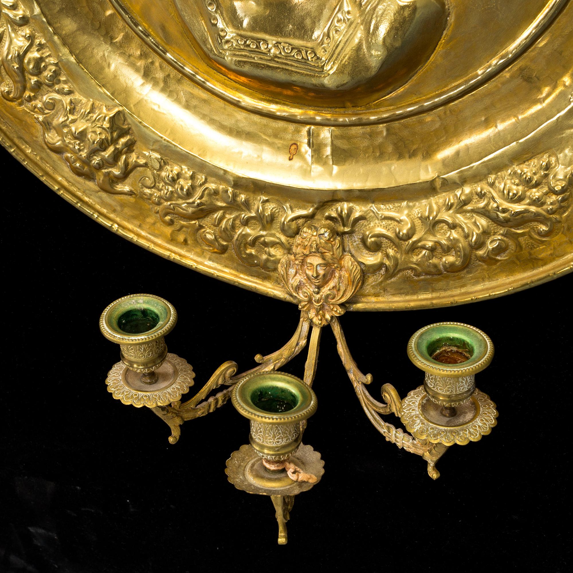 a brass wall scone for three lights, ca 1900.