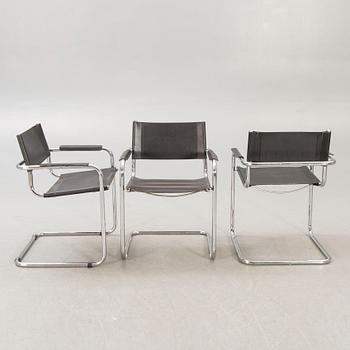 A set of five similar Italian 1970s chrome and leather armchairs.