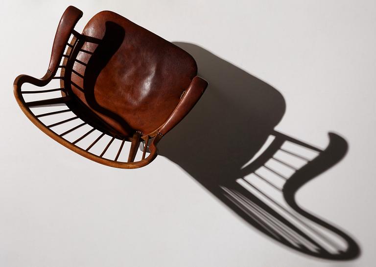 Otto Schulz, a Swedish Modern stained beech and cognac coloured leather armchair.