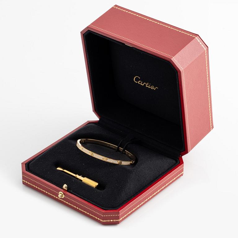 Cartier, "Love" bracelet, small model in 18K gold with brilliant-cut diamonds.