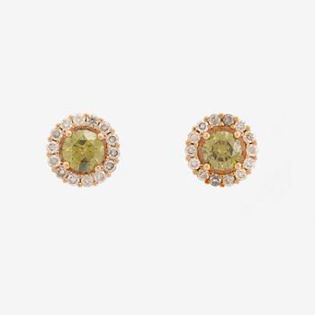 Colour treated green diamond earrings.