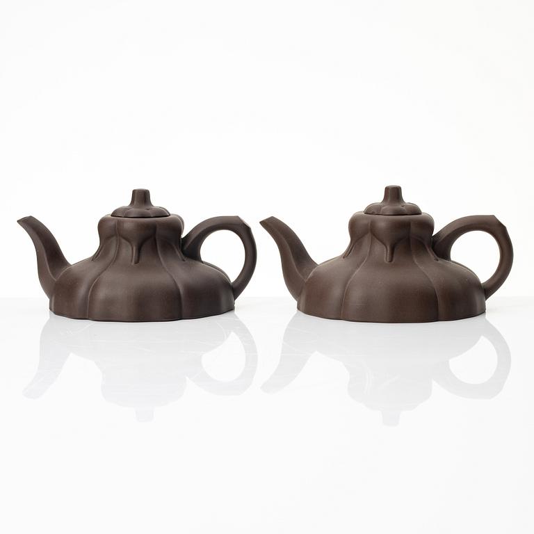 Two similar 'magnolia flower six-petal' yixing teapots, China, 1980s.
