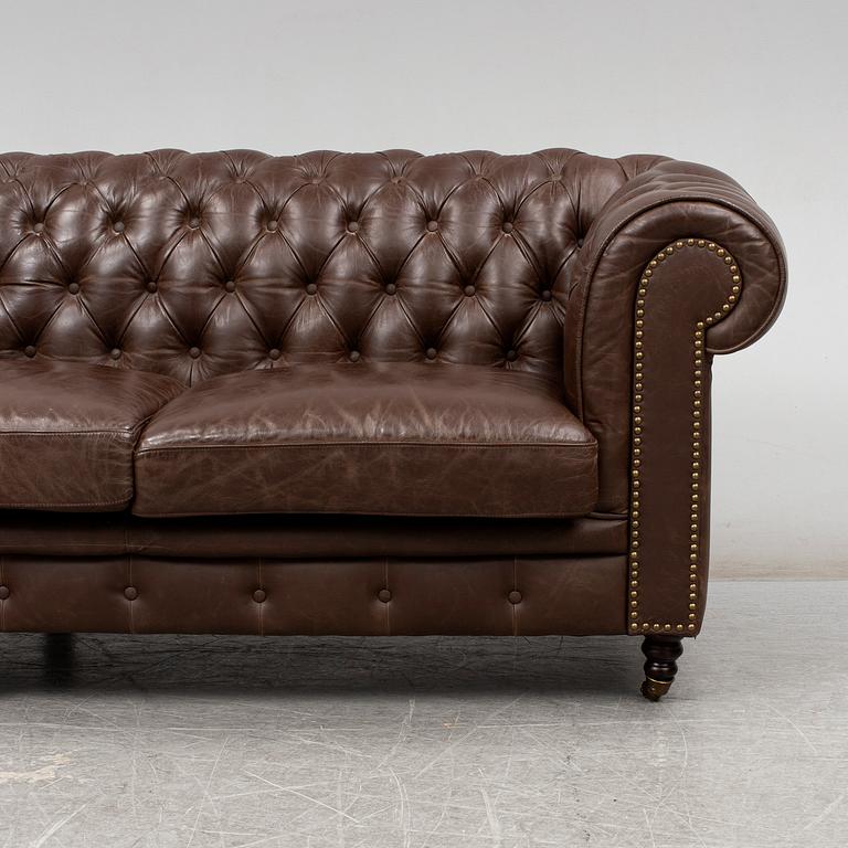 A modern chesterfield sofa.