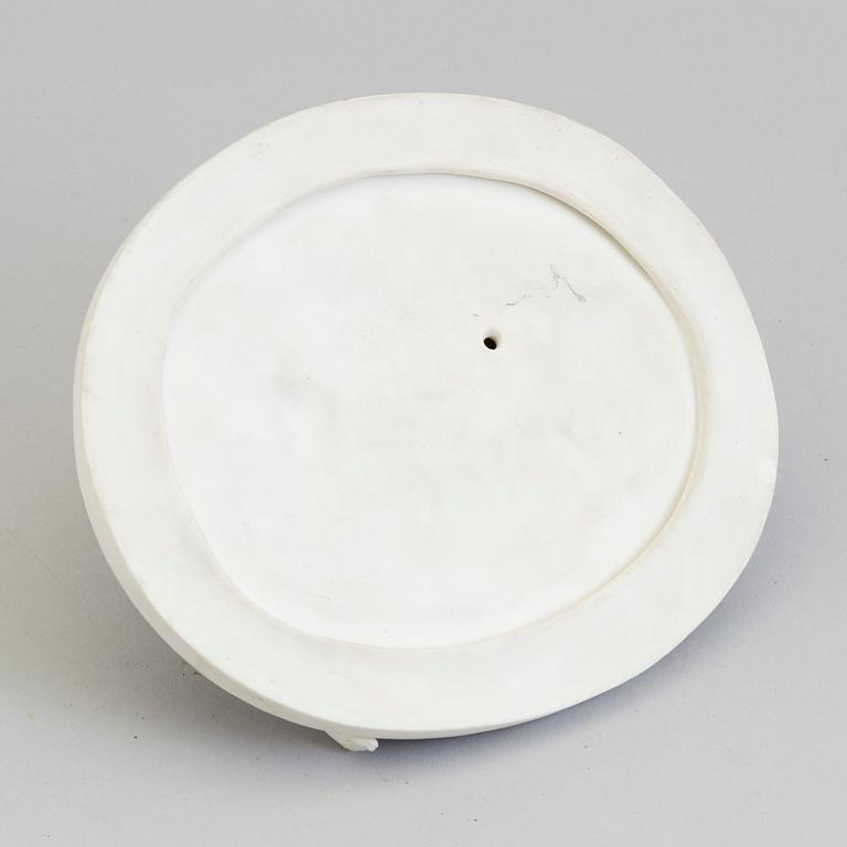 An early 20th century ceramic figurine with the mark AR.