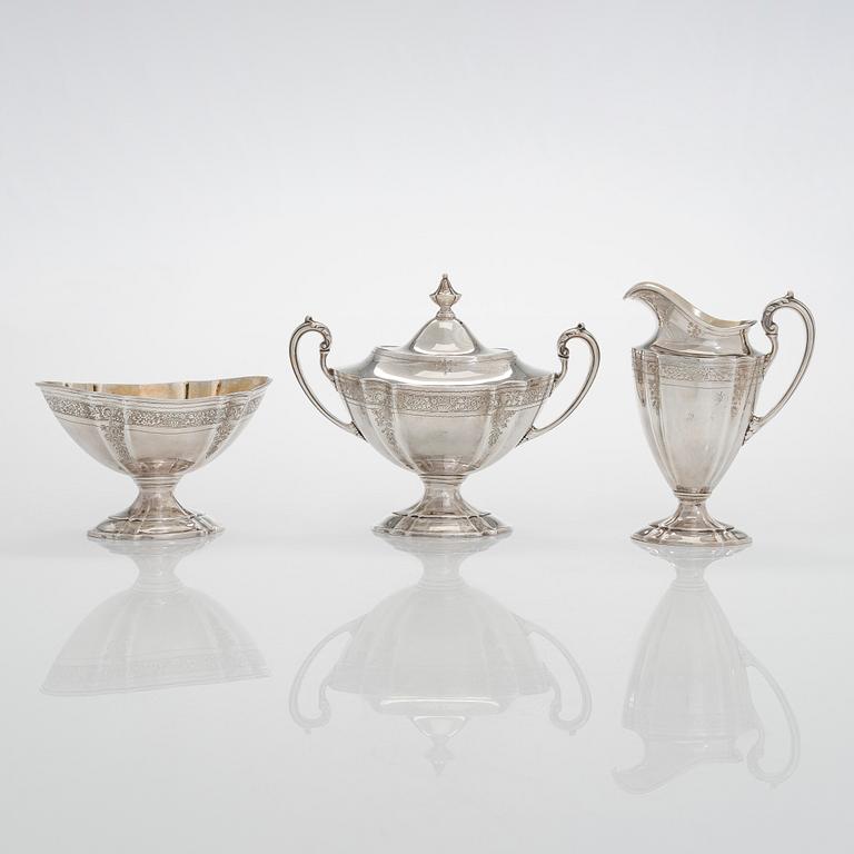 A five-piece sterling silver coffee and tea service, and 12 spoons, USA, first quarter of the 20th century.