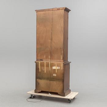 A second half of the 20th century vitrine cabinet marked "Pennsylvania House".