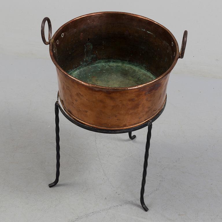 A 19th century copper cauldron.