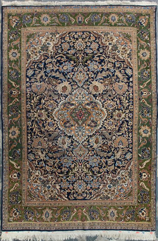An oriental carpet. Qum. Circa 201x140 cm.