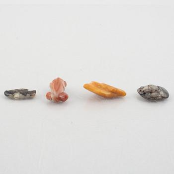 A group of eight Chinese stone charms / pendants, 20th century.