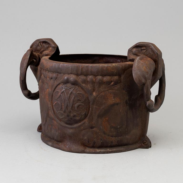 A cast iron plant pot, 1904.