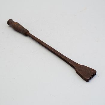 A 18th century branding iron.