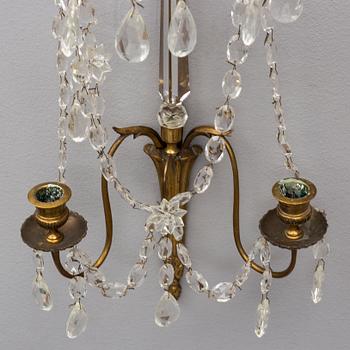 A pair of Gustavian style wall sconces, early 20th Century.