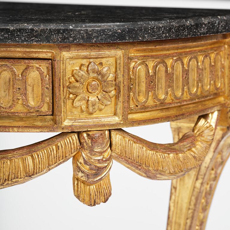 A Gustavian carved giltwood console table, Stockholm, late 18th century.