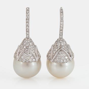 1127. A pair of cultured South Sea pearl and diamond earrings.