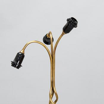 A three-arm floor lamp in brass, mid 20th century.