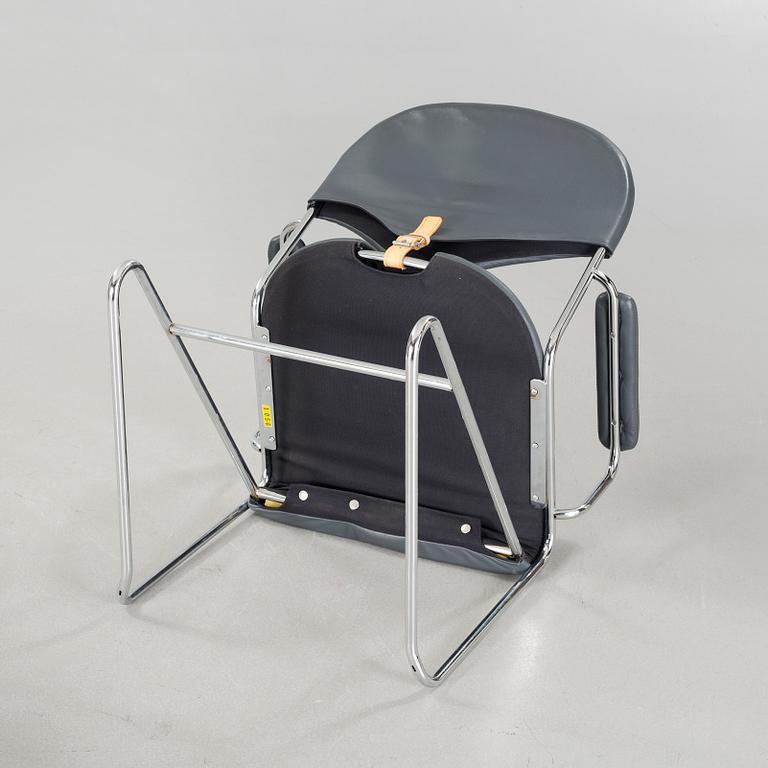 A pair of chairs by Sam Larsson for Dux, designed in 1974.