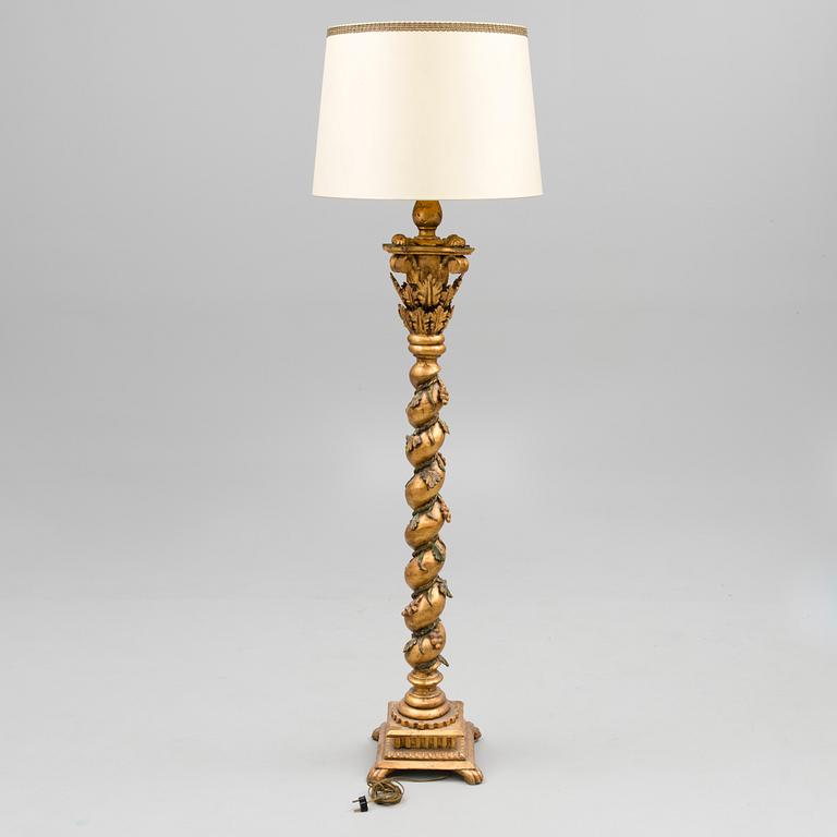 A Baroque style 1920s standard lamp.