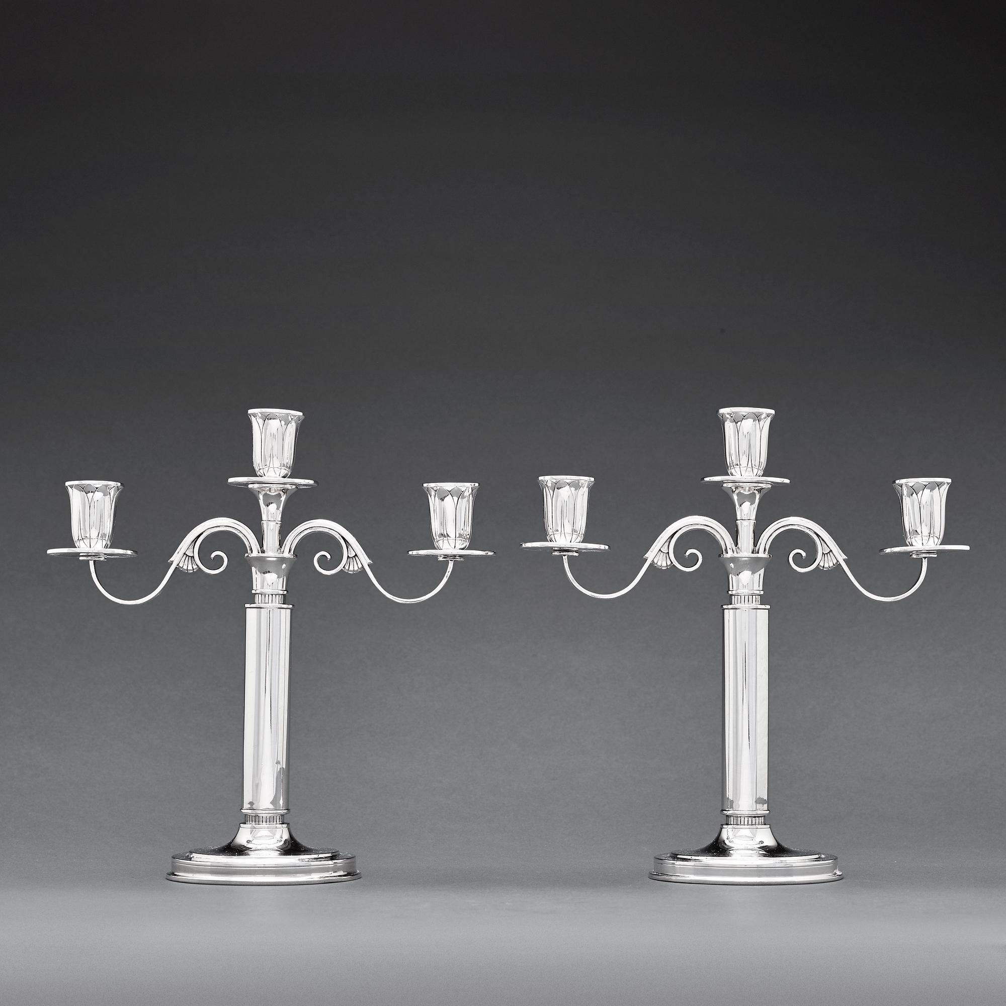 W.A Bolin, a pair of two branched silver candelabra, Stockholm 1935.