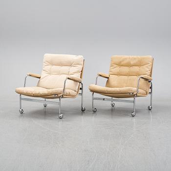 Bruno Mathsson, a pair of easy chairs and a coffee table, 'Karin', Dux, second half of the 20th Century.