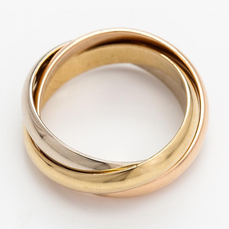 les must de Cartier, ring "Trinity", 18K guld. Märkt les must de Cartier, A5512Y.