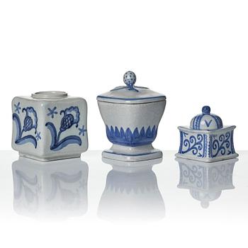 Wilhelm Kåge, eleven pieces of faience including jars, inkwells and a tulip vase, Gustavsberg, Sweden, 1919-1920.
