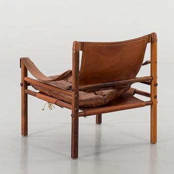 AN ARNE NORELL"SIROCCO" CHAIR.