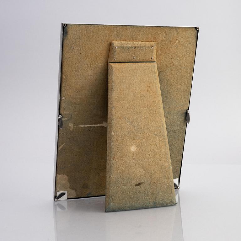A silver and enamel frame with glass, mark of CG Hallberg, Stockholm 1937.