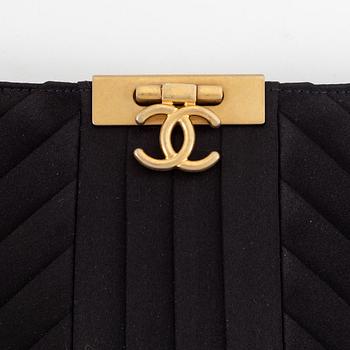 Chanel, a black satin clutch, 2019.