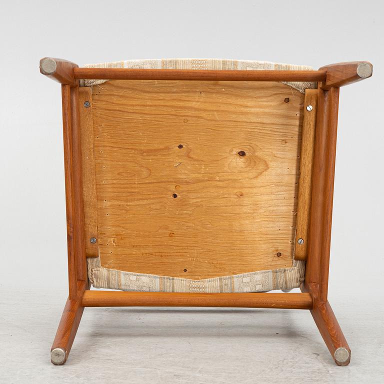 A dining table with six chairs, mid 20th century.