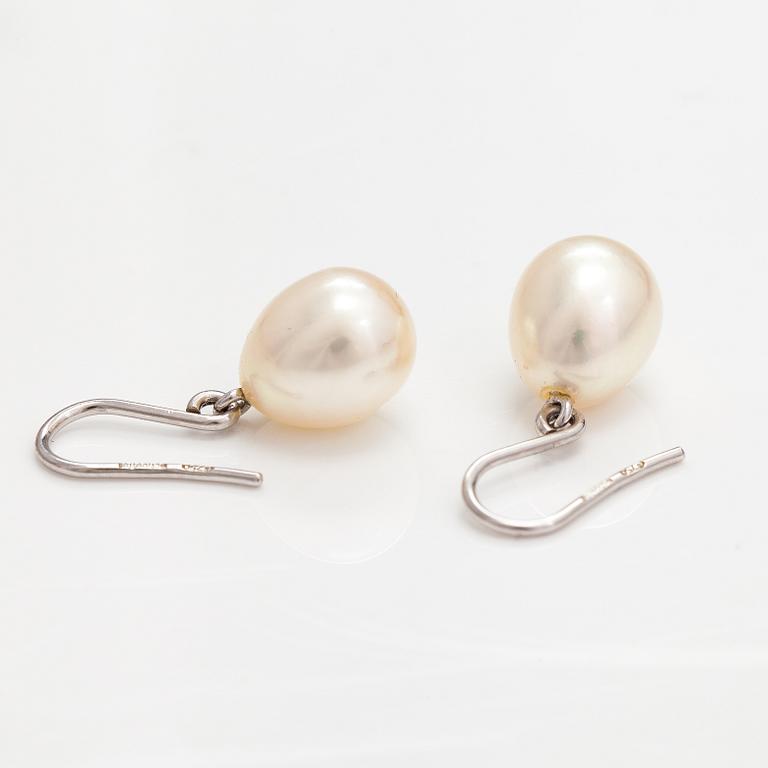 A pair of 18K white gold earrings with drop shaped cultured pearls. Schoeffel.