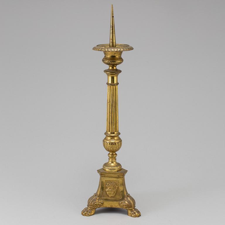 A 18th century bronze candlestick.