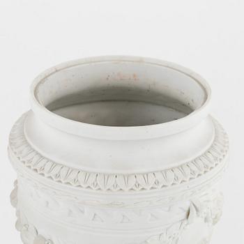 A pair of biscuit porcelain urns, owner's monogram of Oscar II of Sweden, mid 19th century.