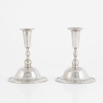 Firma Svenskt Tenn, a pair of pewter candlesticks model "76", Stockholm 1925.