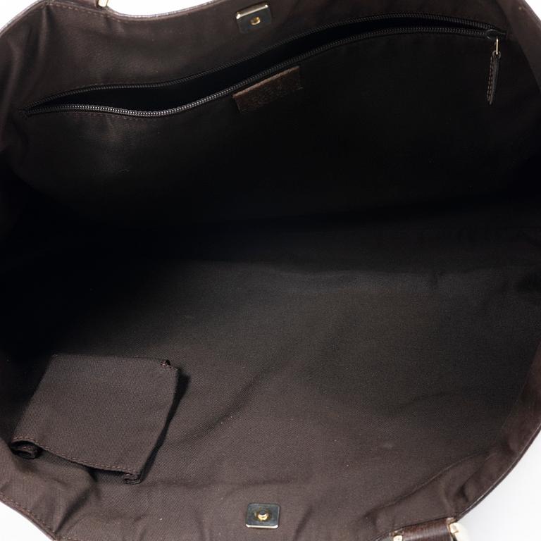 Gucci, a canvas and leather bag.
