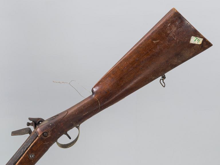 A 18/19th century flintlock rifle.