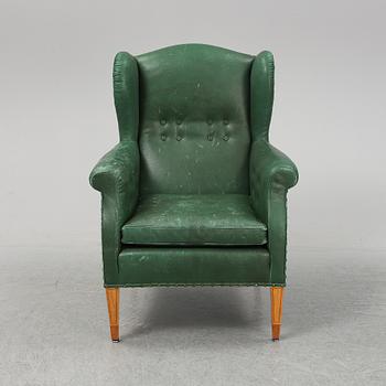 A leather wing-chair.