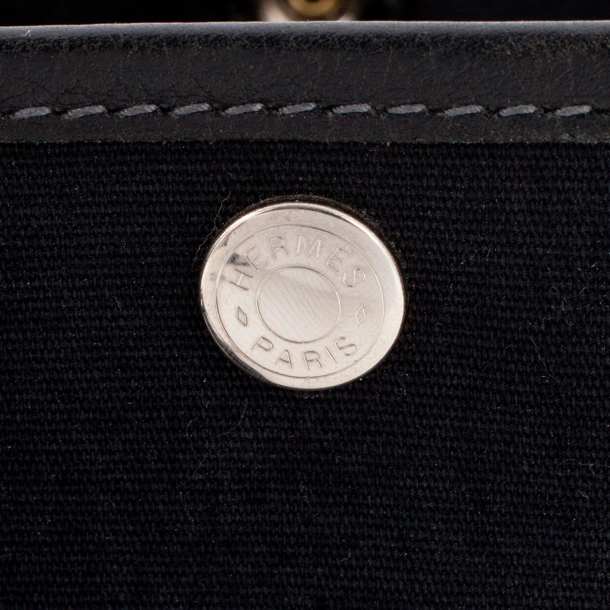 HERMÈS, a black canvas and leather bag, "Garden Party".