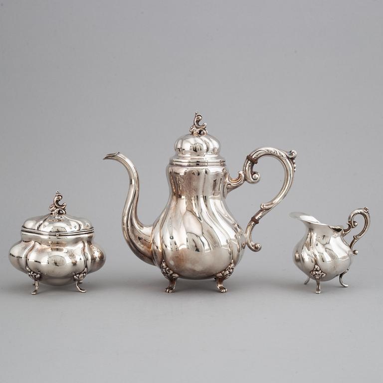 A silver coffee pot, creamer and sugar bowl. Swedish import marks.