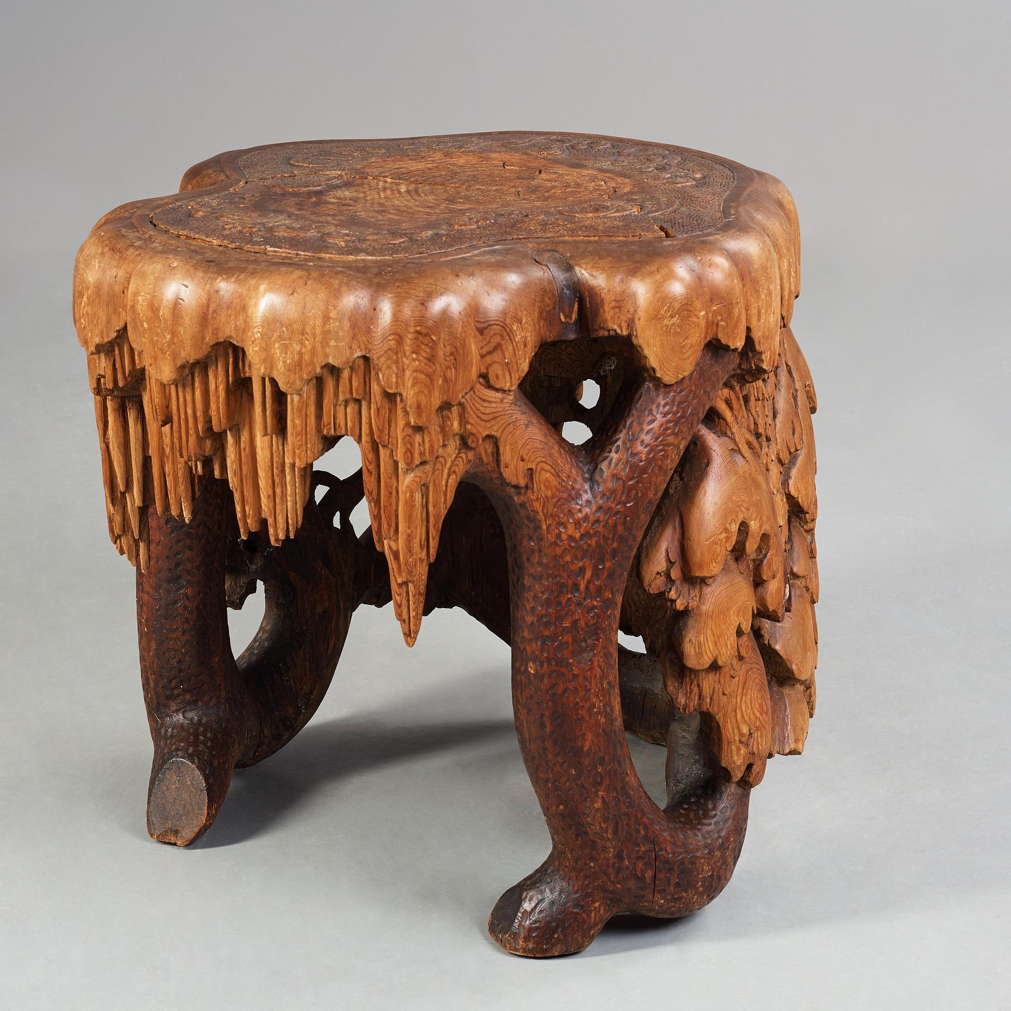 Knut Fjaestad, A Knut Fjaestad Art Nouveau sculptured pine table, Sweden ca 1900.