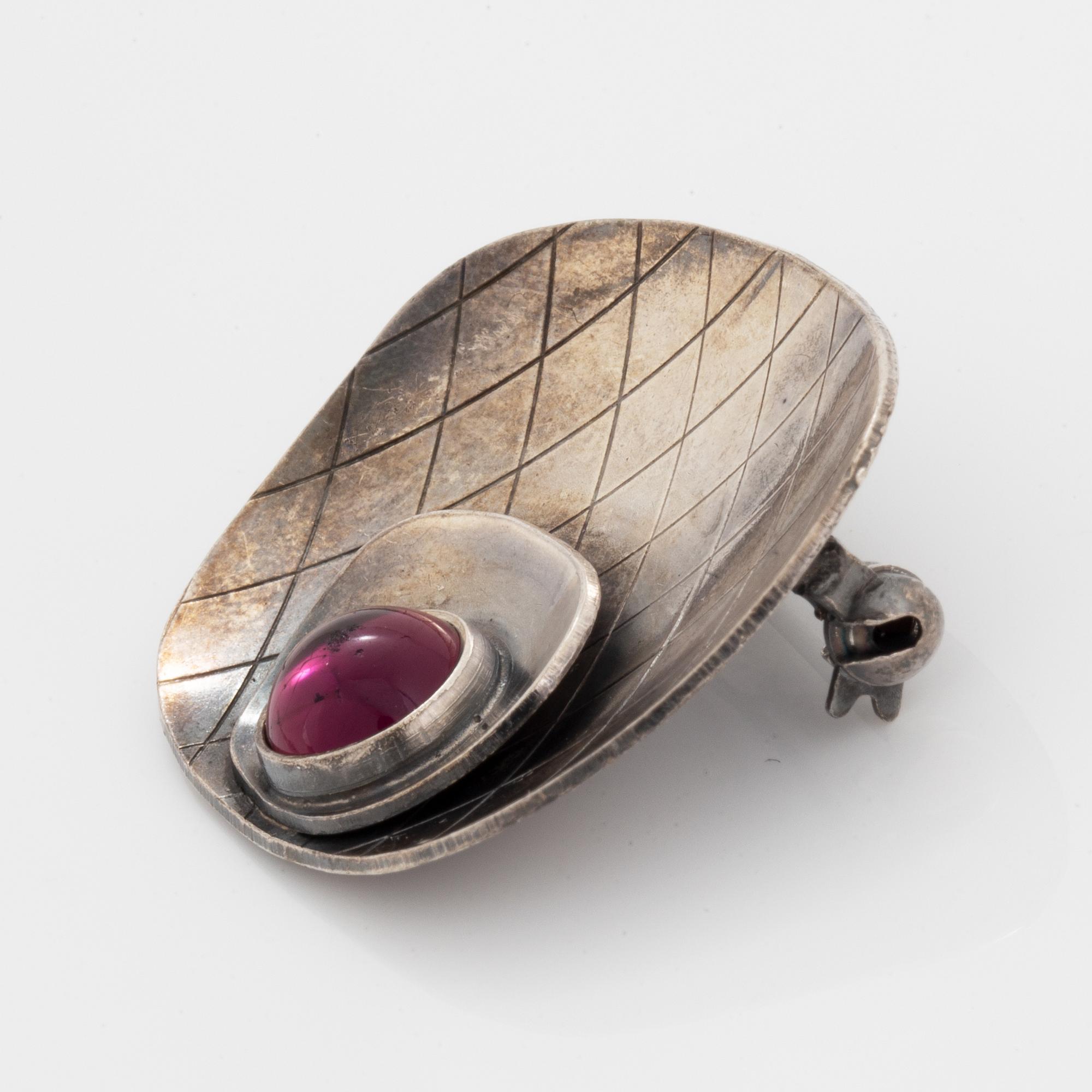 Five pendants and one brooch, silver.