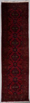 An Afghan runner, ca. 295 x 82 cm.