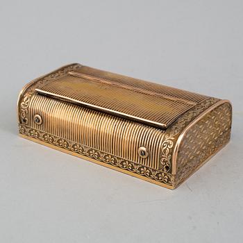 A brass music box, about 1900.