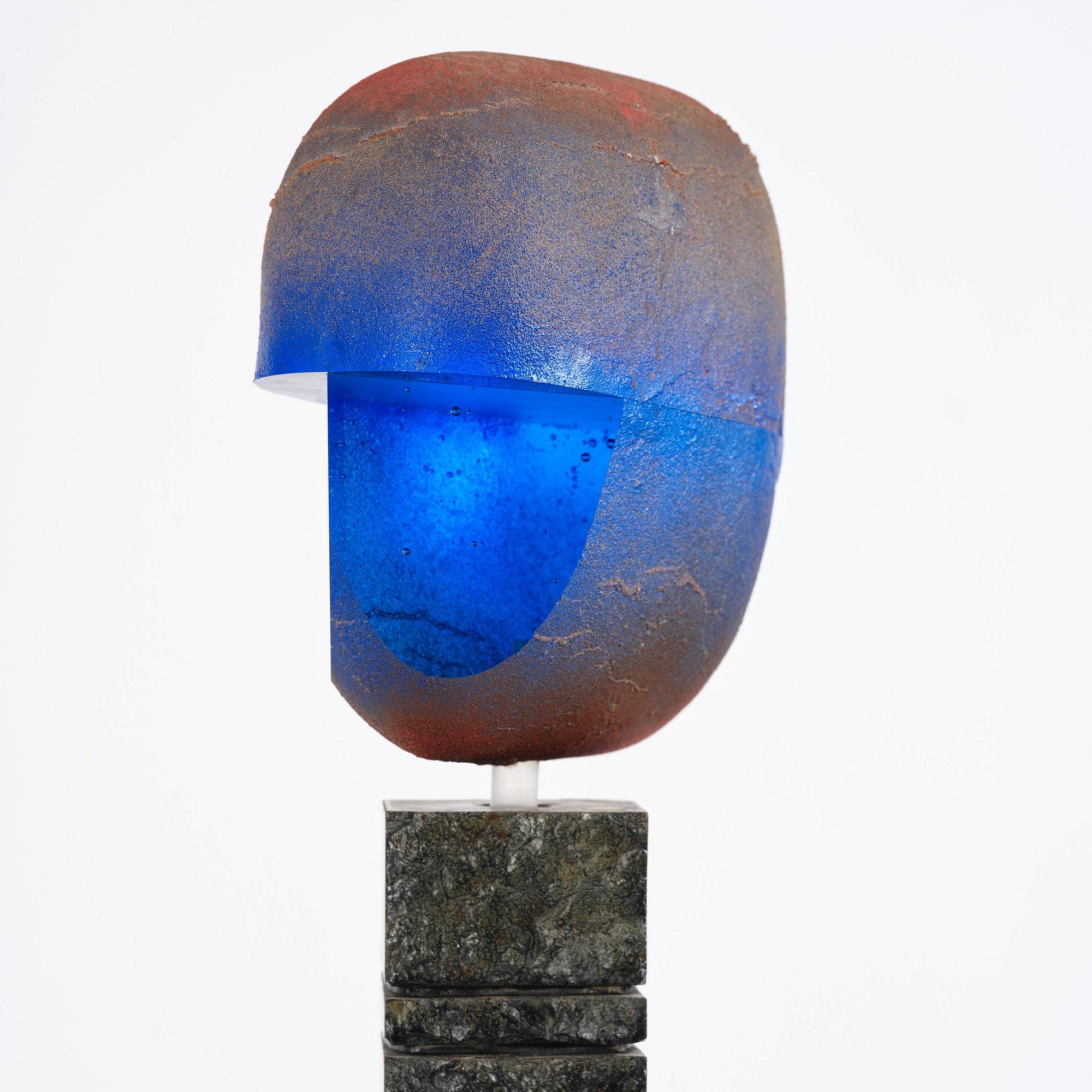 Bertil Vallien, a unique sand-cast glass sculpture of a head, on a high pedestal of polished limestone, Kosta Boda.