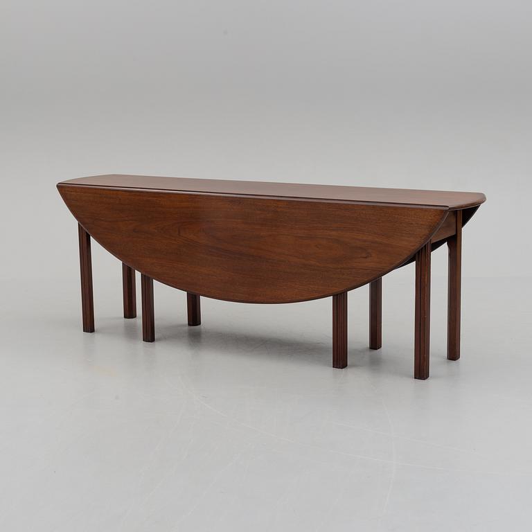 A DINING TABLE, England, made for NK, Nordiska Kompaniet, Sweden. Signed with label. Probably 1960s / 70s.