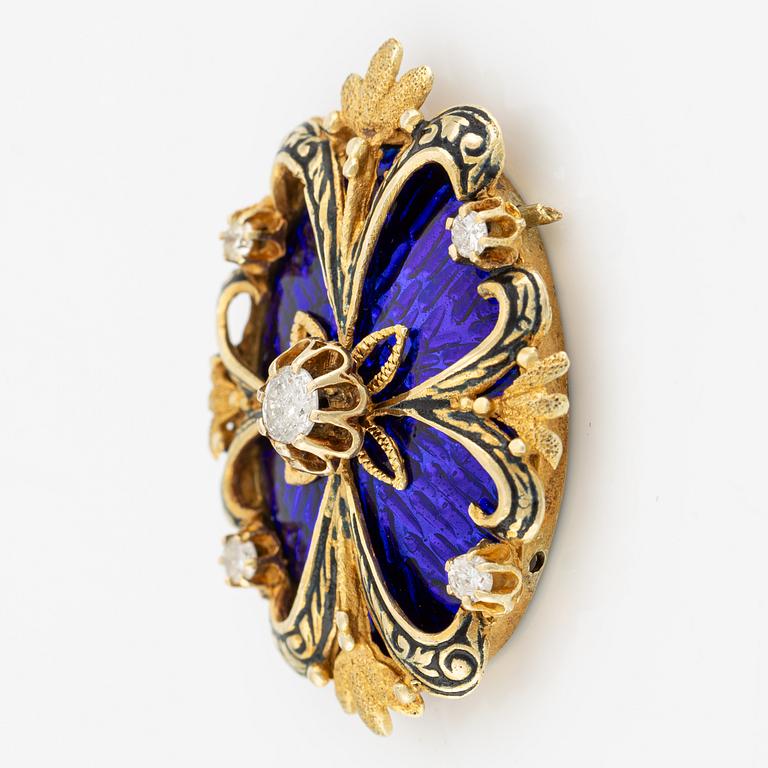 Brooch/clasp in gold with blue enamel and brilliant-cut diamonds.