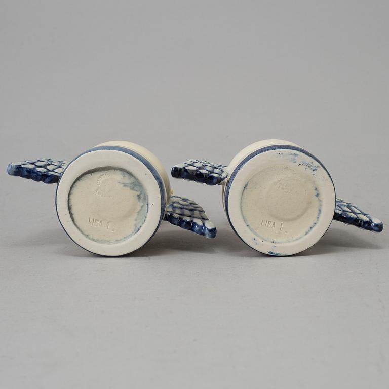 A pair of stoneware angel candel sticks from Gustavsberg.