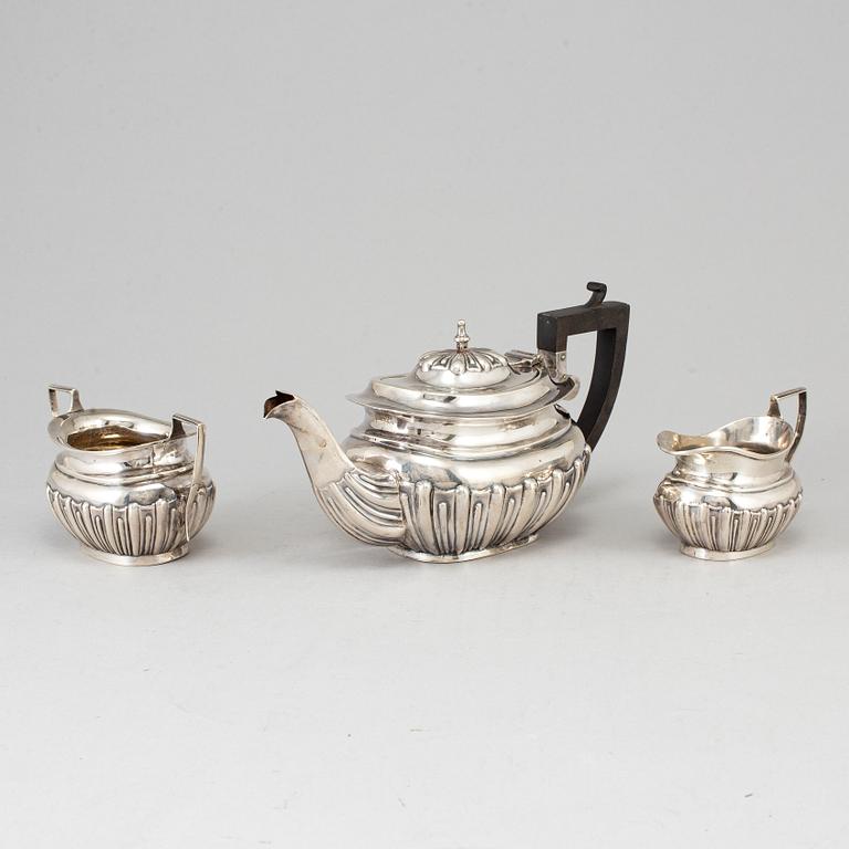 A silver teapot, creamer and sugar bowl, S Glass, Birmingham 1908.