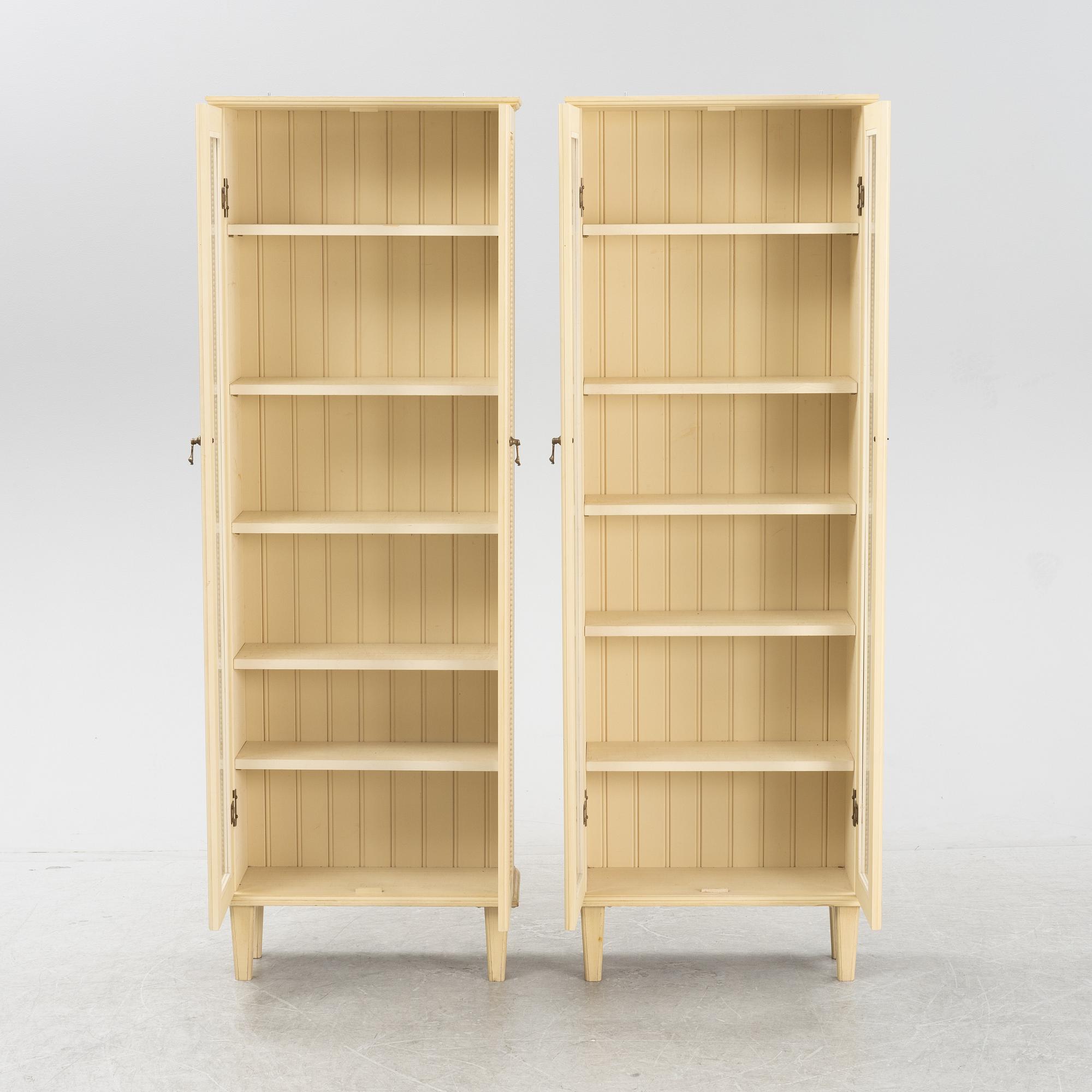 A pair of Gustavian style book cabinets, 21st century.